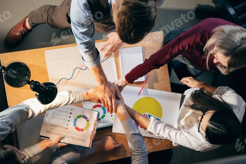 Preview: Colleagues working together in modern office using devices and gadgets during creative meeting
