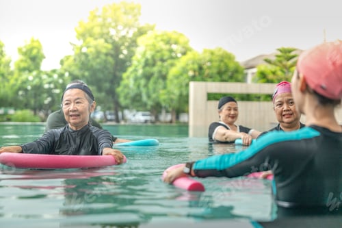 Preview: senior aquatic class practicing water relaxation and float