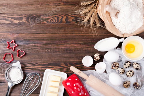 Preview: Ingredients for baking. Flour in paper bag, eggs, butter, milk, rolling pin, whisk