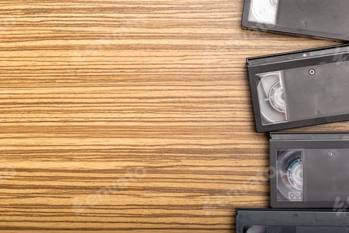 Preview: video tape cassette over wooden background