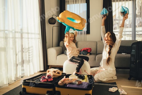 Preview: Mother and daughter packing before the trip.