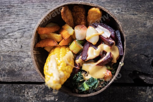 Preview: Organic vegan meal with corn, tempeh protein and vegetables served in coconut bowl