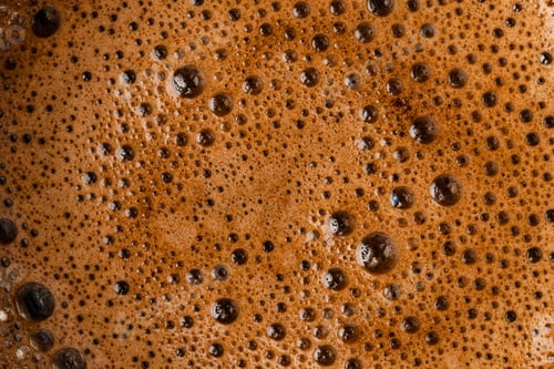 Preview: Brown coffee foam with bubles top view
