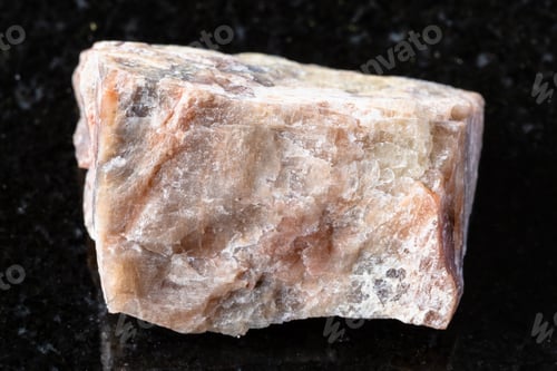 Preview: sample of unpolished nepheline mineral on black