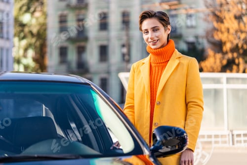 Preview: Beautiful young woman with short hair drives car in the city