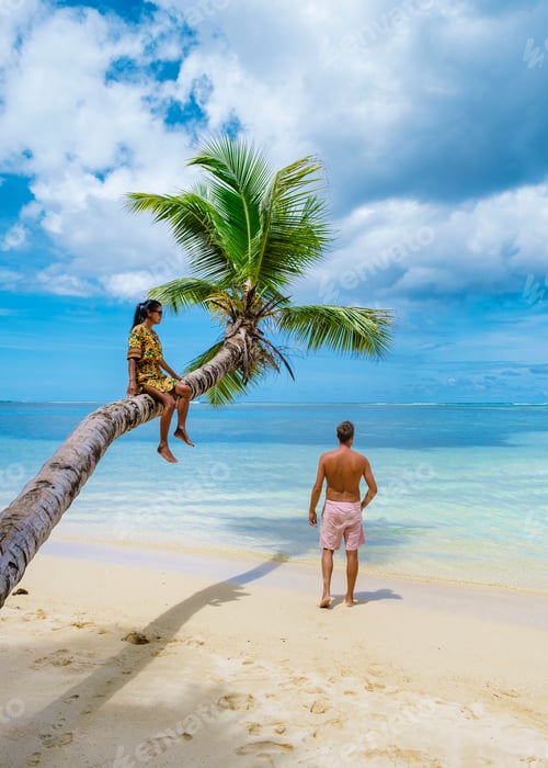 Preview: Mahe Seychelles, tropical beach with palm trees and, couple man and woman on vacation Seychelles