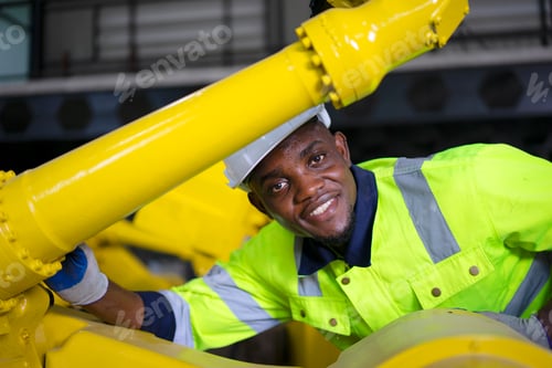 Preview: Engineer work at robotic arm factory.