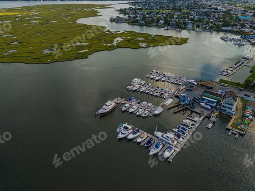 Preview: High angle aerial view over Island Park, Long Island, New York on a sunny day with blue skies