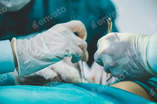 Preview: Medical team of surgeons in hospital doing invasive surgical interventions