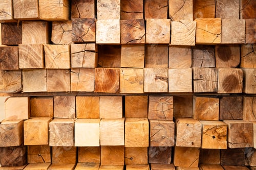 Preview: Wooden stacked in a warehouse, close-up. Wooden industrial background