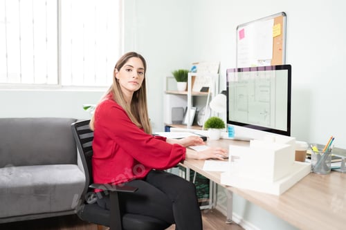 Preview: Female architect in an office
