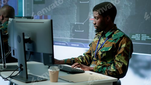 Preview: Military personnel in a control center working on data processing