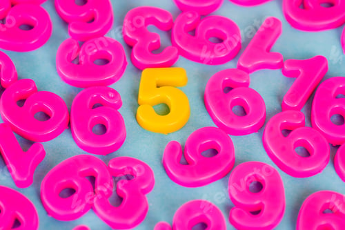 Preview: Yellow five number and pink plastic numbers on blue background