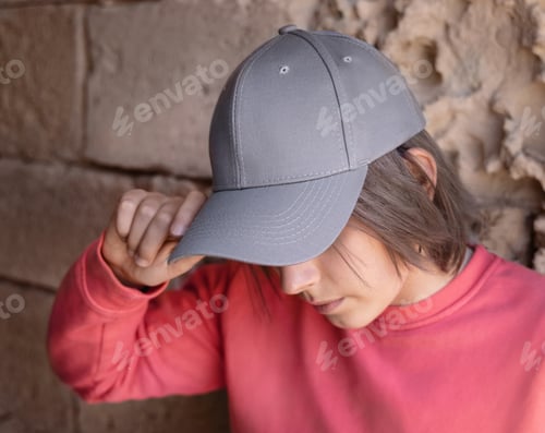 Preview: Teenager girl in grey baseball cap and long sleeve shirt outdoor, mockup