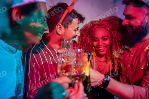 Preview: Friends making a toast at New Year party midnight countdown