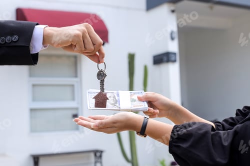 Preview: Real Estate Agent Handing Over Keys to New Homeowner