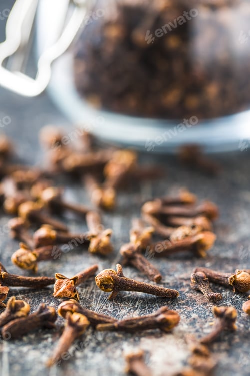 Aromatic Cloves on Rustic Table, Cooking Ingredient