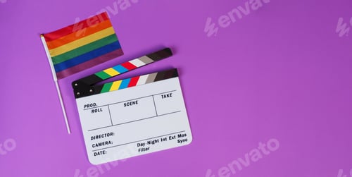 Preview: Clapper board and rainbow pride flag on purple or violet background.