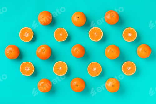 Preview: Fruit pattern of fresh mandarin slices on blue background.