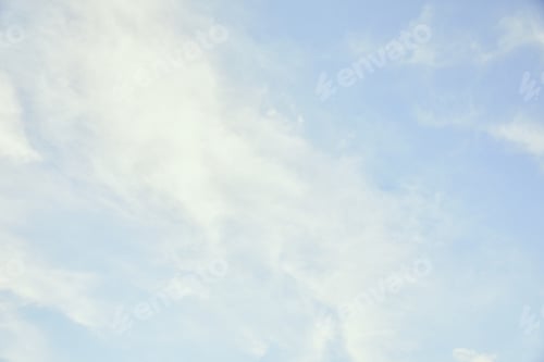 Preview: Peaceful light blue sky with white clouds and copy space