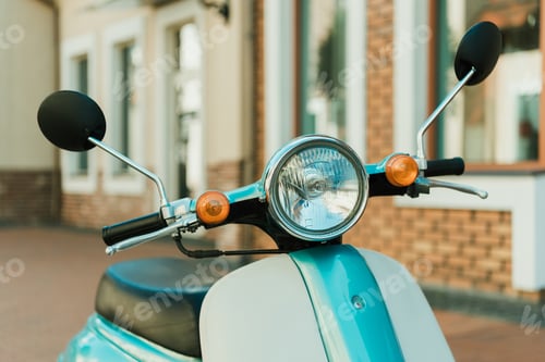 Preview: close up view retro scooter parked on city street