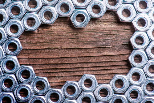 Preview: Chrome nuts on wooden background