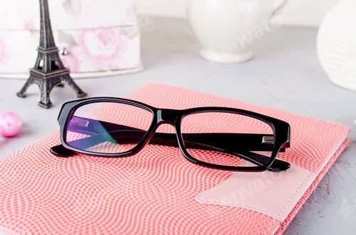 Preview: workplace with empty notebook,pen, tulips, eyeglass, work from home or blogging concept