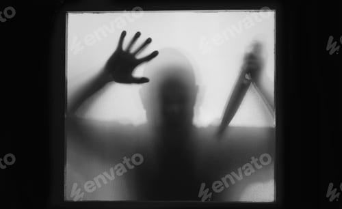 Preview: Man killer with a knife in his hand. Creepy background