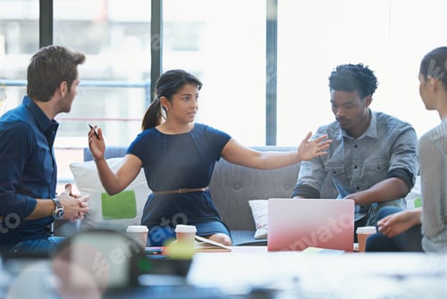 Preview: Expansion is important. Shot of a group of office workers talking together in a meeting room.