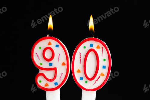 Preview: Celebrating a milestone with colorful candles marking a 90th birthday event