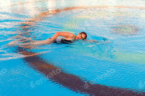 Preview: The girl swims in the pool in crawl style