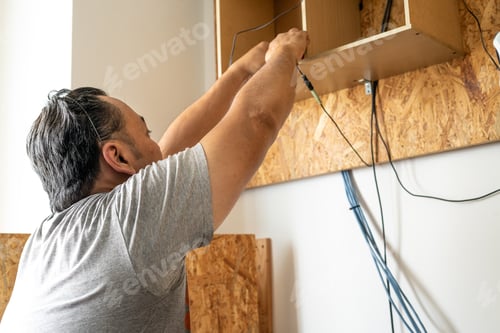 Preview: Man at home DIY in free time and hobby during quarantine.