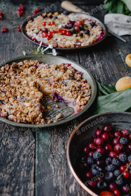 Preview: delicious pies with berries on wooden table