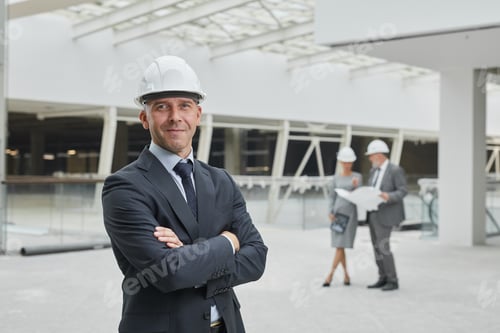Preview: Smiling Businessman at Construction Site