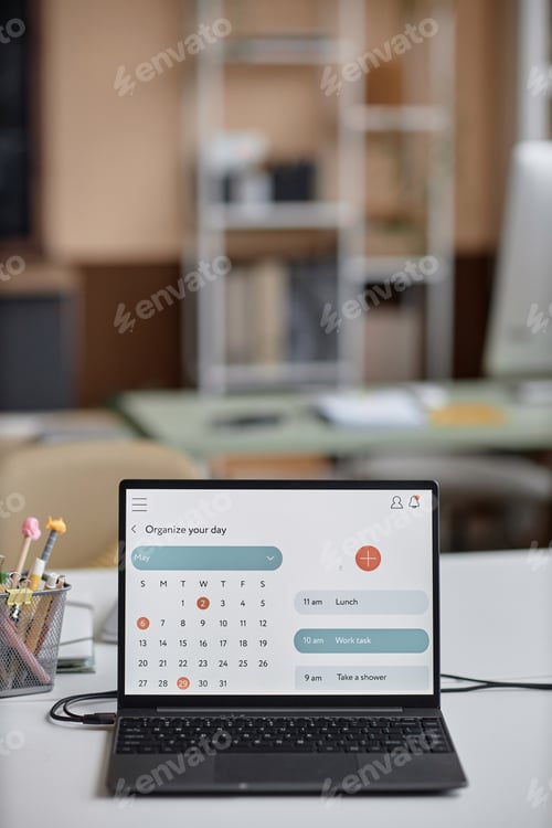 Preview: Laptop Computer on Desk Displaying Calendar Page on Screen