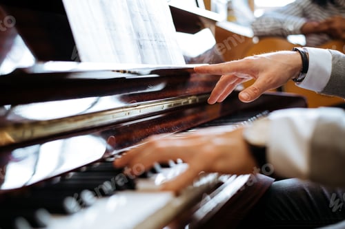 Preview: Crop male hands playing piano