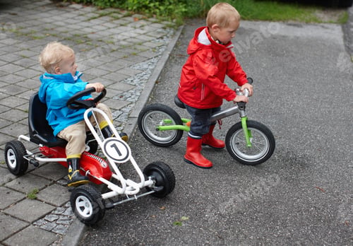 Preview: Toddler boys riding bike and go-cart