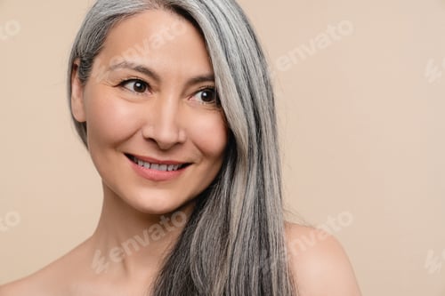 Preview: Woman with long grey hair. Hair care and treatment. Hair growth volume effect. Aging skin