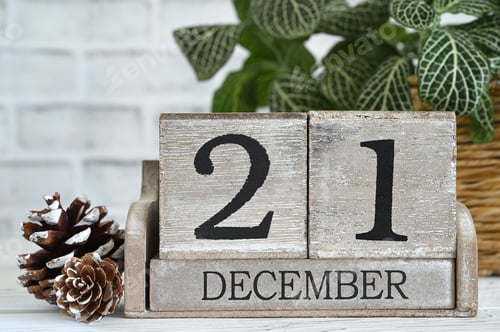 Preview: First Day of Winter aka Winter Equinox or solstice - December 21 on a wooden block calendar sitting