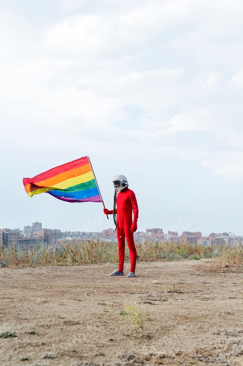 Preview: Astronaut holding an LGBT flag . Gay Pride