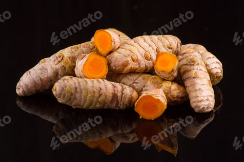 Preview: turmeric powder and roots on wooden background