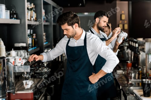 Baristas Working in a Cafe Setting During Daytime