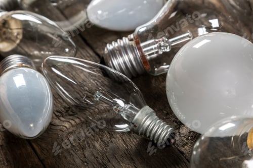 Preview: Lightbulbs on wooden background