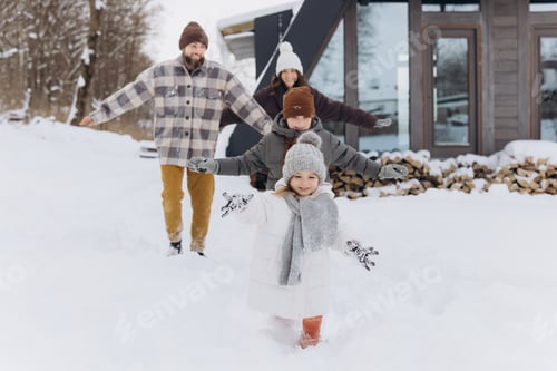 Preview: Family walking in snow having winter fun
