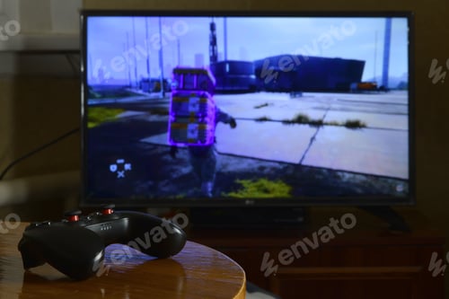 Preview: KHARKOV, UKRAINE - NOVEMBER 12, 2020: Video game controller Gamesir g3s on table with Death Strandi