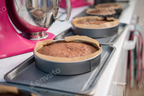 Preview: Row of cakes cooling off on top of ovens in bakery