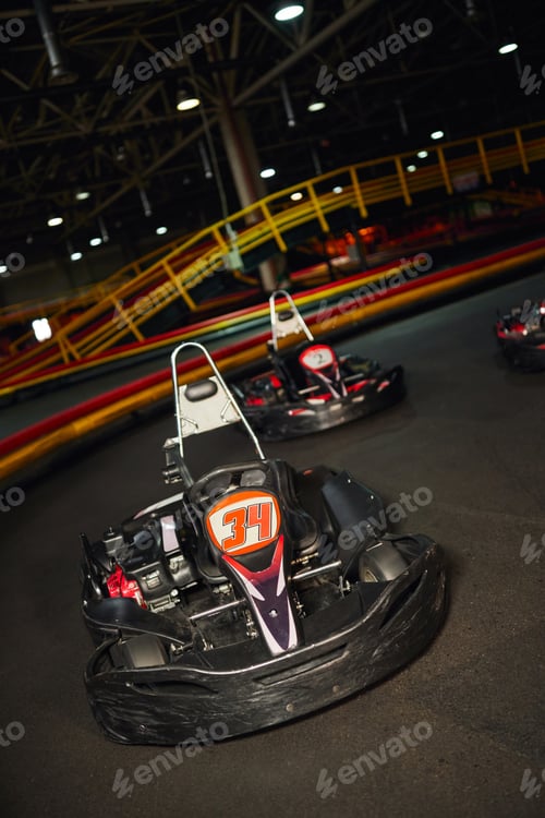Preview: modern racing cars inside of indoor circuit, motor race vehicles, go kart for speed racing