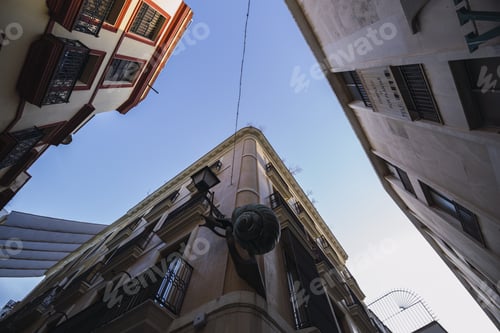 Preview: Low angle shot of apartment buildings under blue sky
