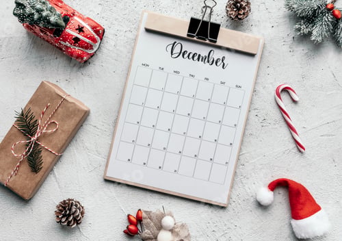 Preview: Top view of December calendar on table. Christmas decorations.
