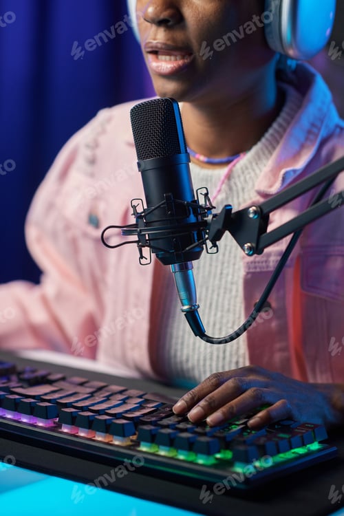 Preview: Girl Speaking To Mic and Playing Video Game